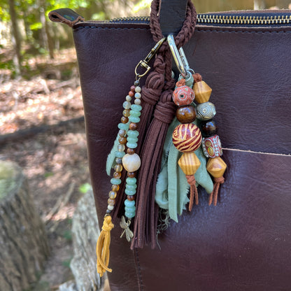 beaded bag charms and brown tassel on brown tote