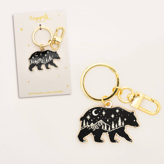 Black bear keychain with gold accents on a white background