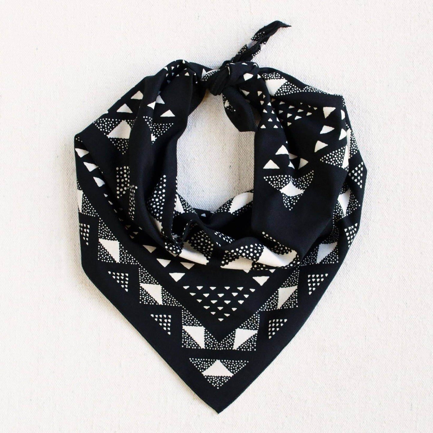 Black bandana with white geometric pattern on a white background