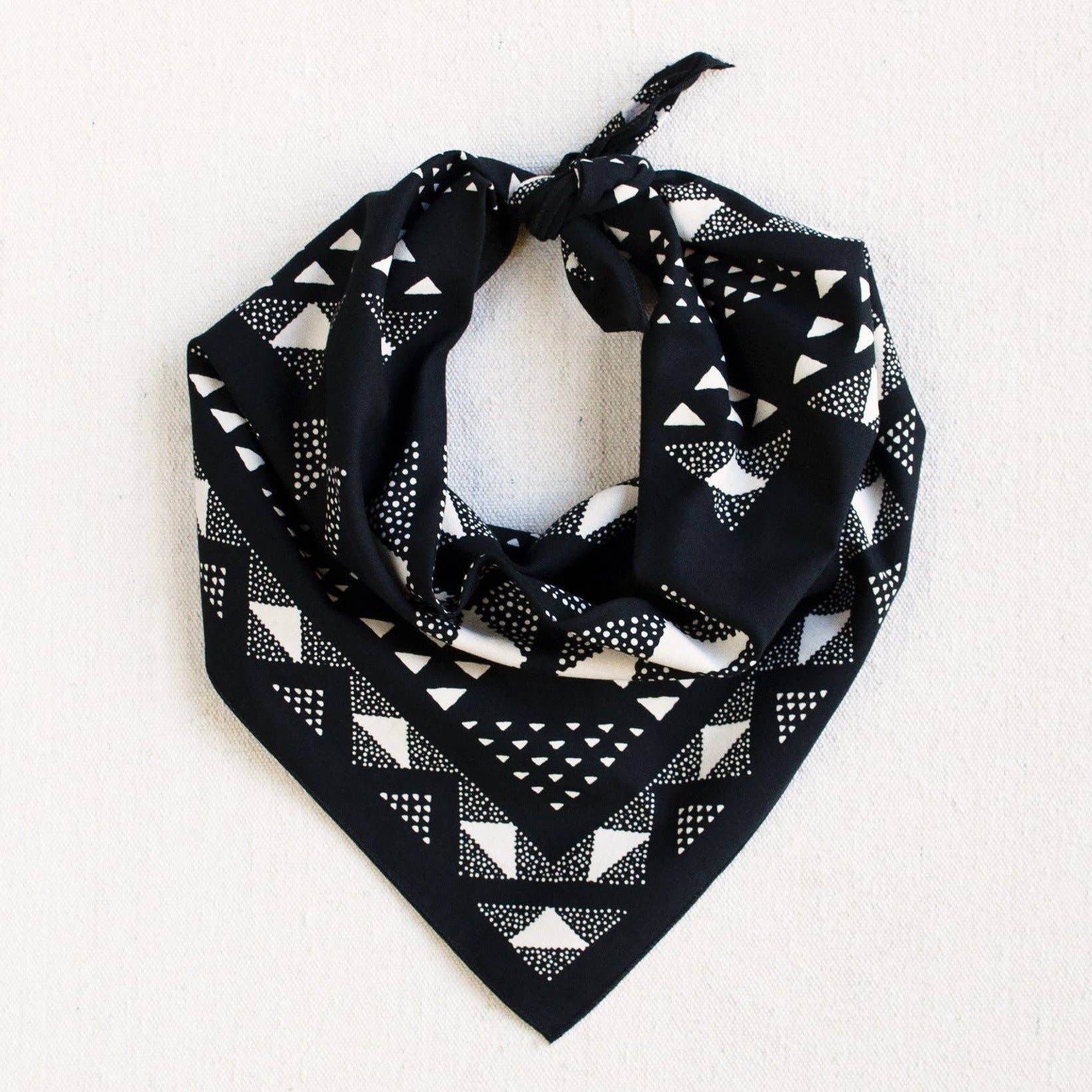 Black bandana with white geometric pattern on a white background