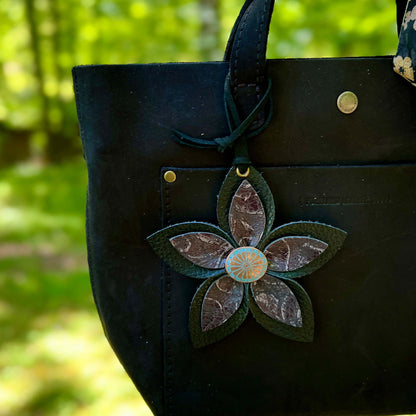 black leather flower bag charm on black purse