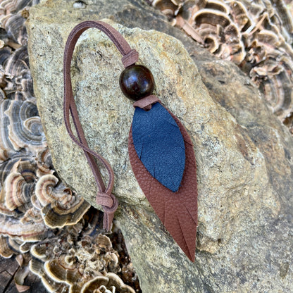 blue and brown leather feather bag charm