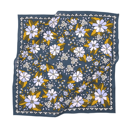 Floral patterned fabric square on a black background
