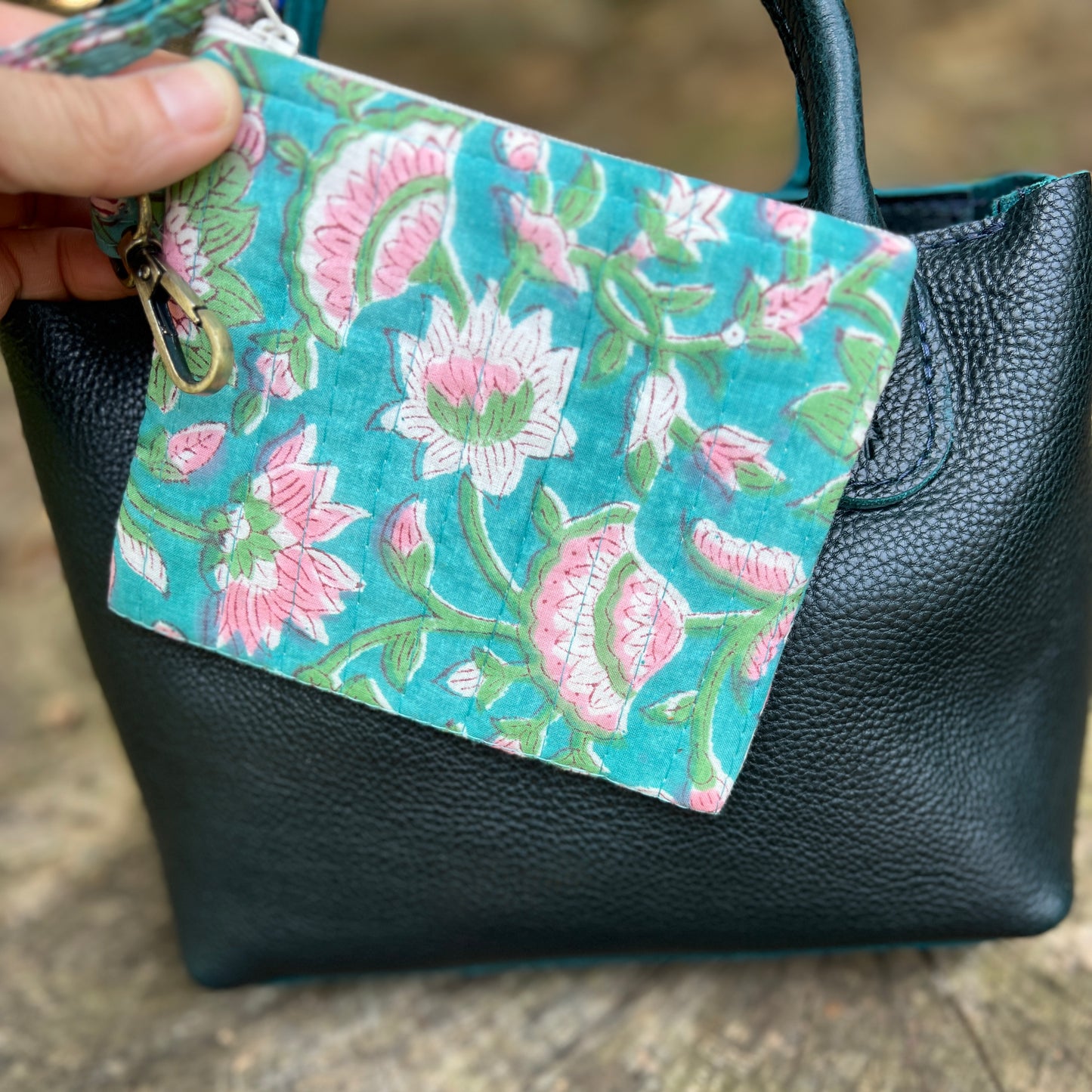 blue floral zipper pouch on boreal bag