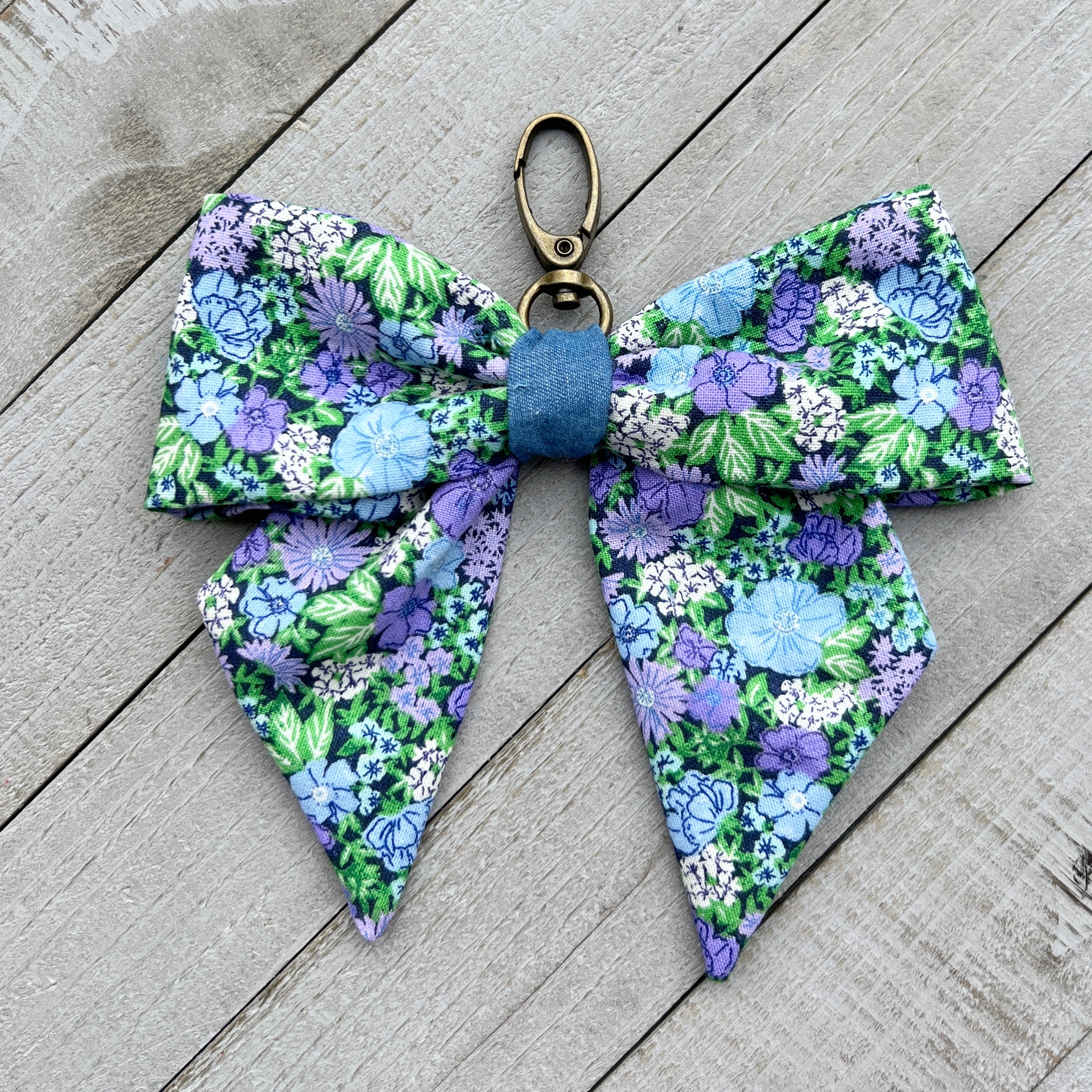 bow bag charm in blue and purple wildflower