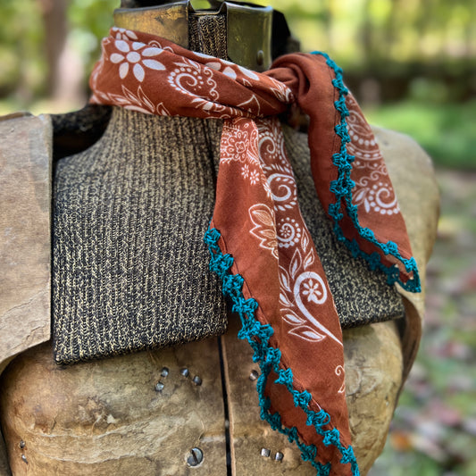 brown and white paisley bandana with blue cotton trim