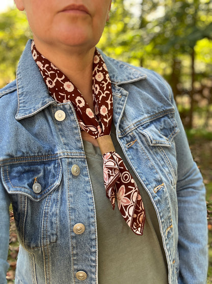 brown floral bandana scarf with leather slide on person with denim jacket