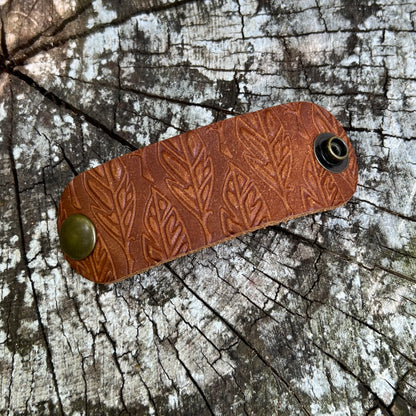 brown leather bandana slide embossed with feathers