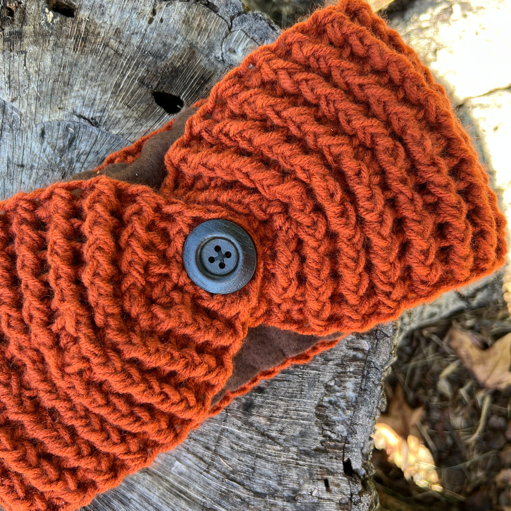 winter headband with fleece lining and button in burnt orange