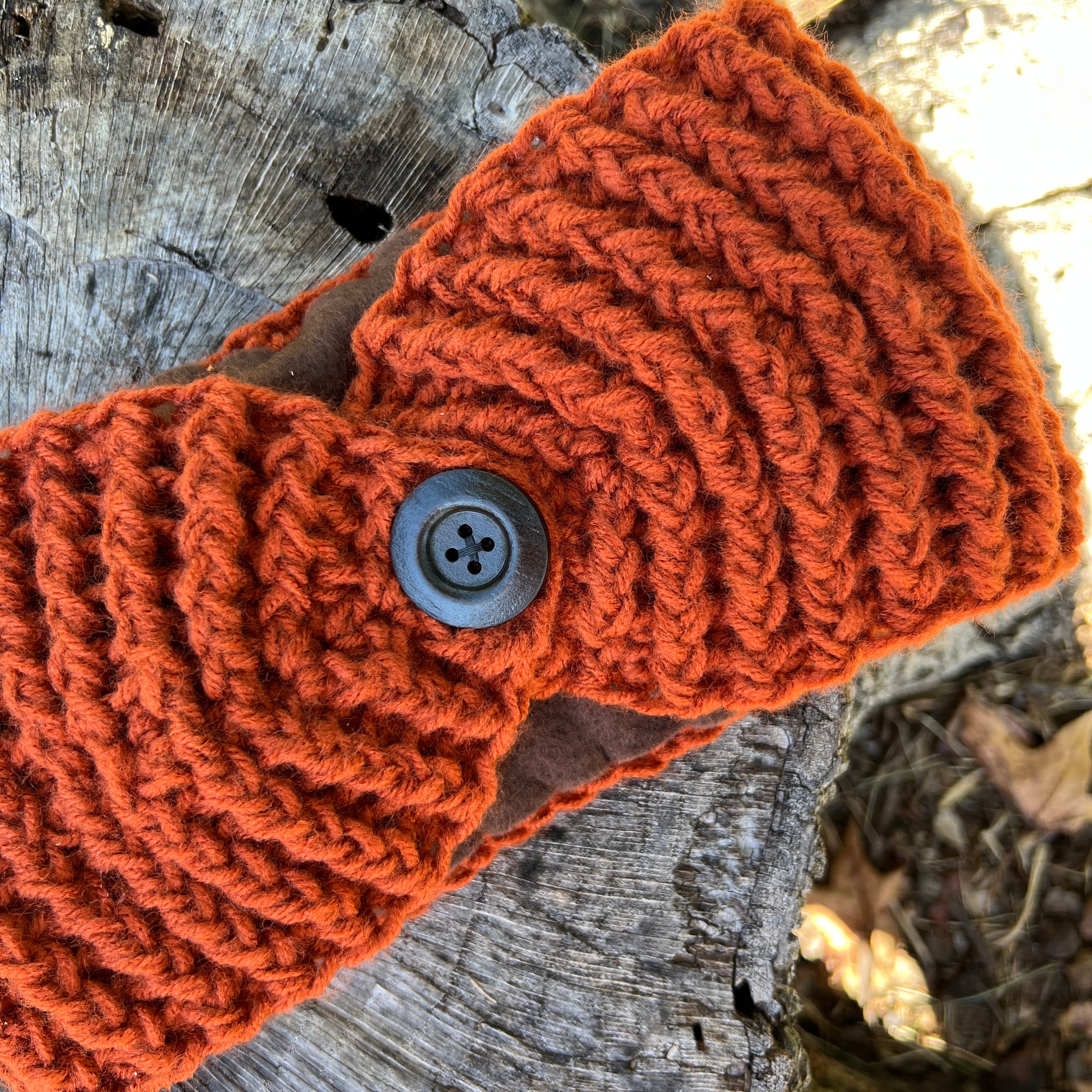 winter headband with fleece lining and button in burnt orange
