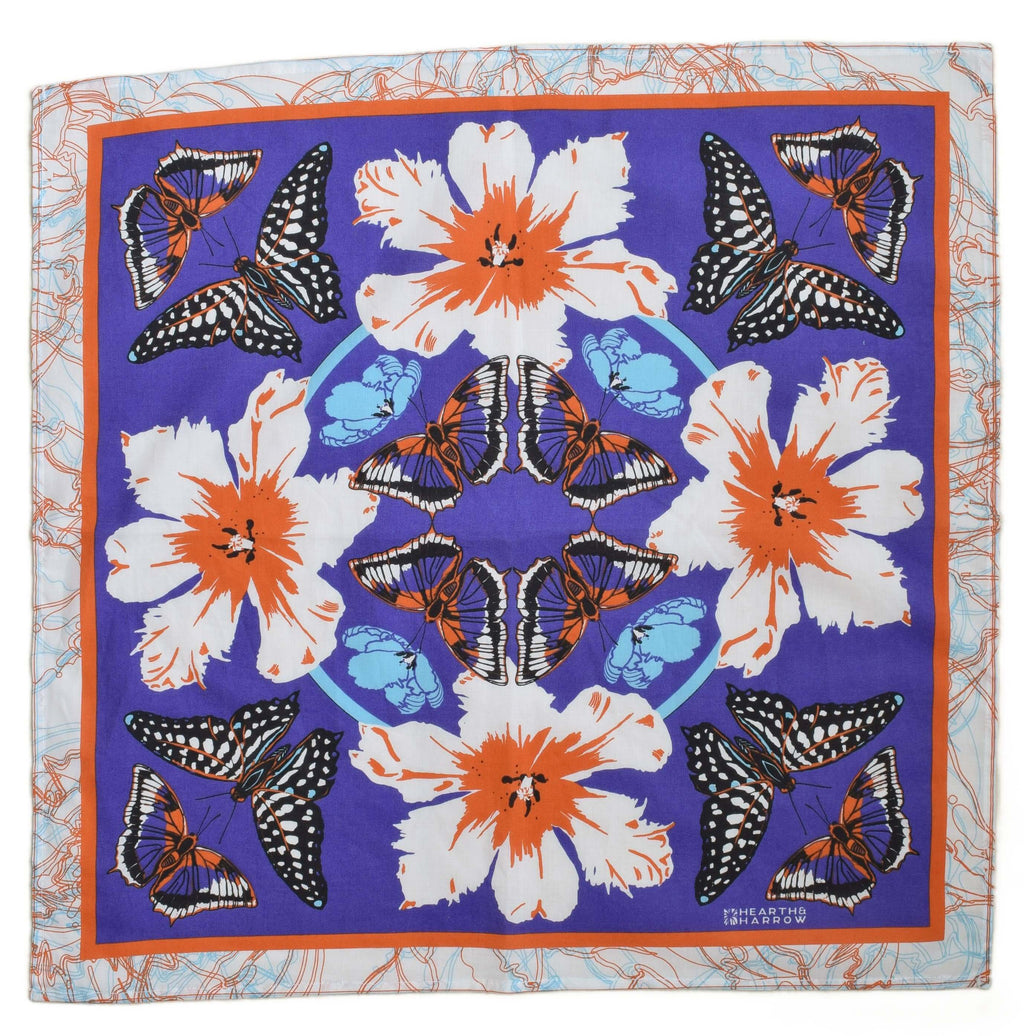 Scarf with floral and butterfly pattern on a purple background