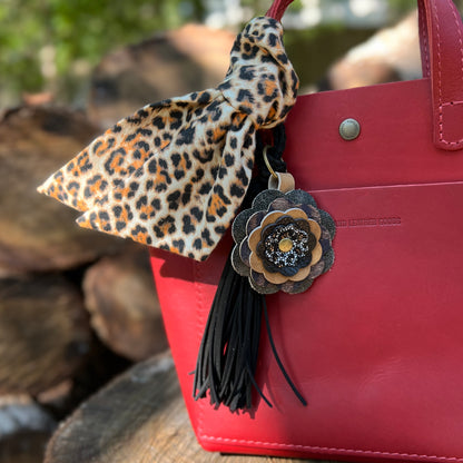 cheetah scarf, leather flower and black tassel on red tote