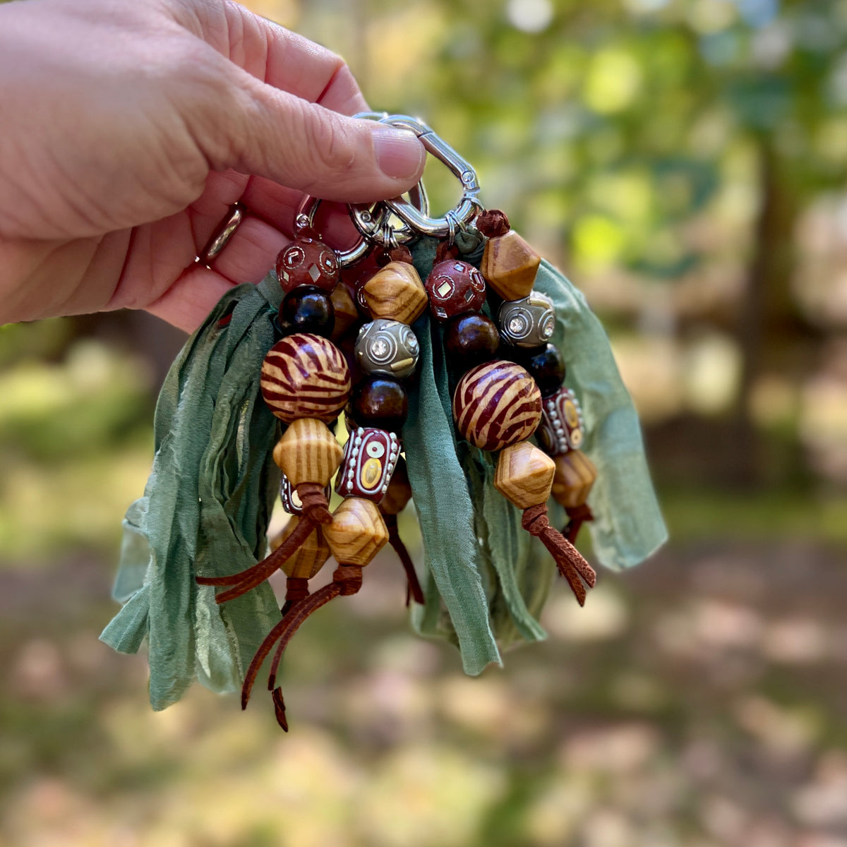 chunky beaded charm with green silk tassel 