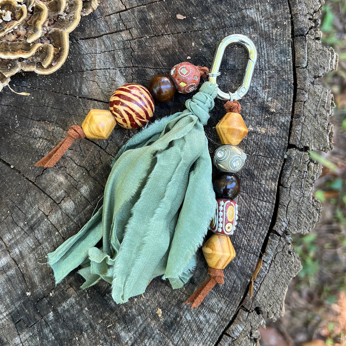 chunky beaded charm with green silk tassel