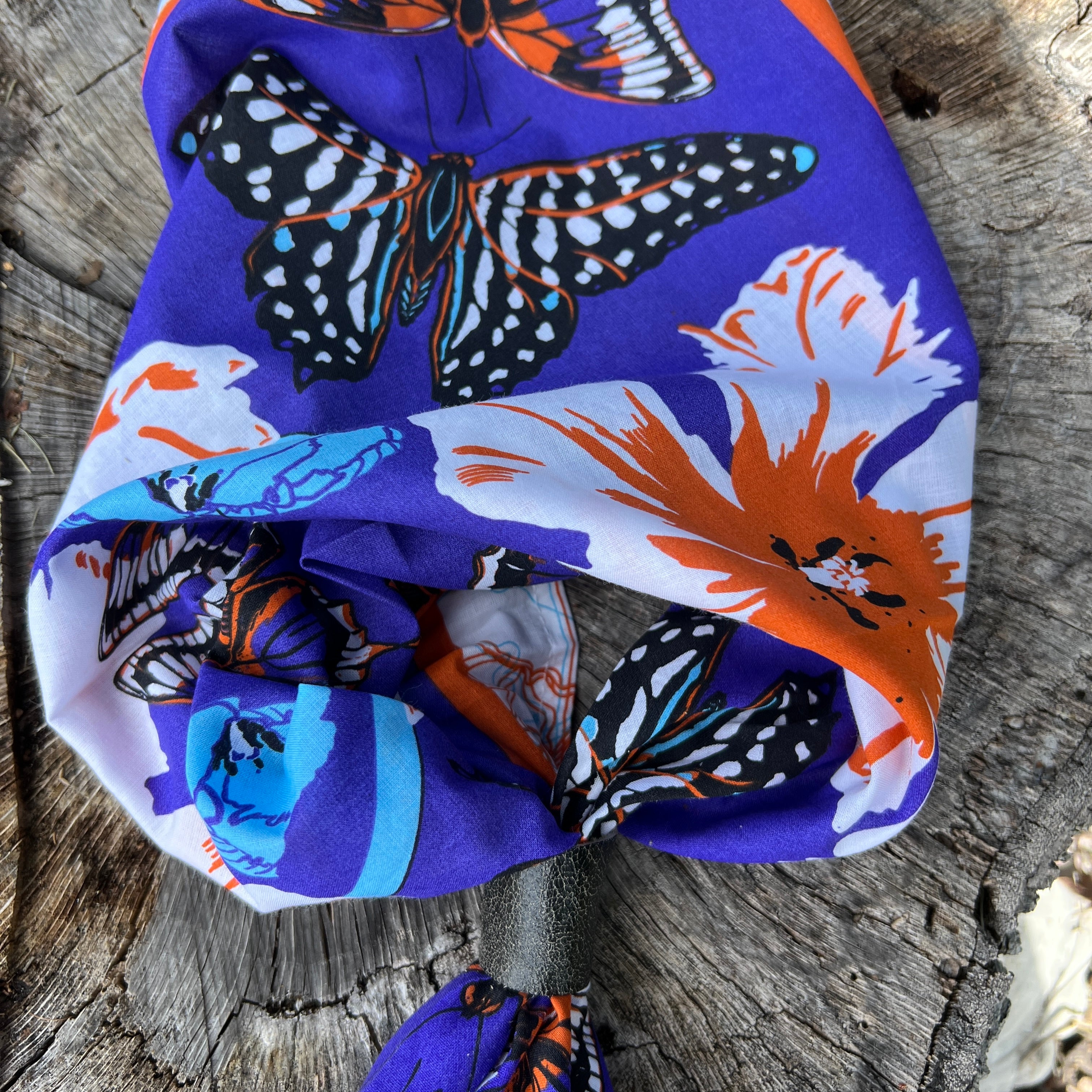 butterfly print bandana in purple with black leather slide

