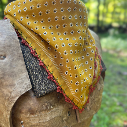close up of yellow floral bandana