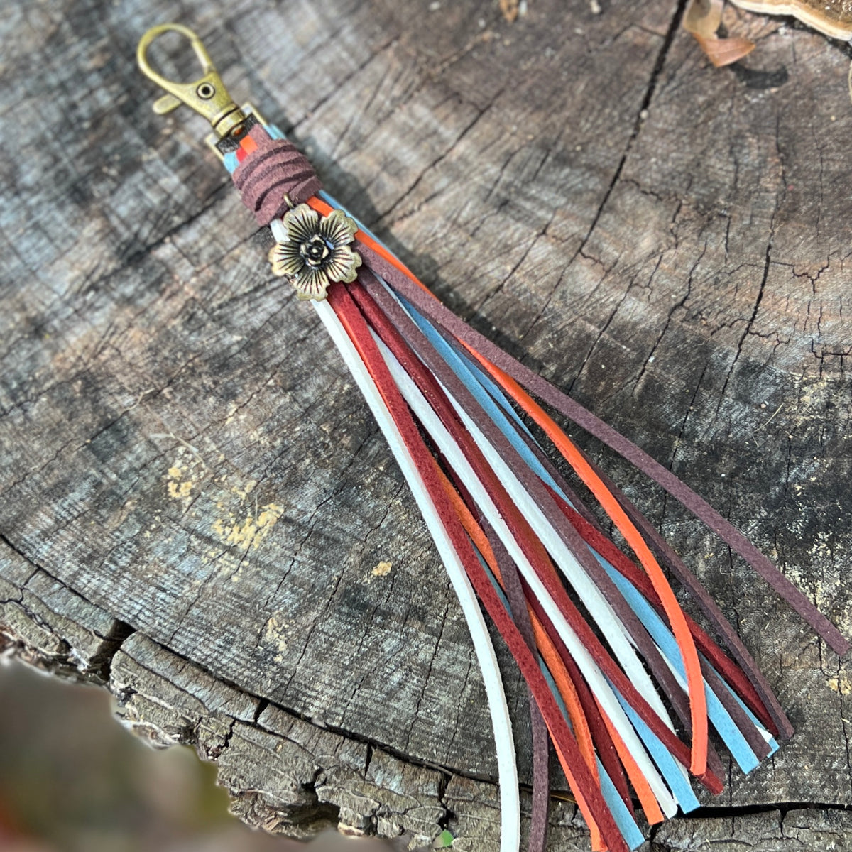 colorful faux suede tassel with flower charm