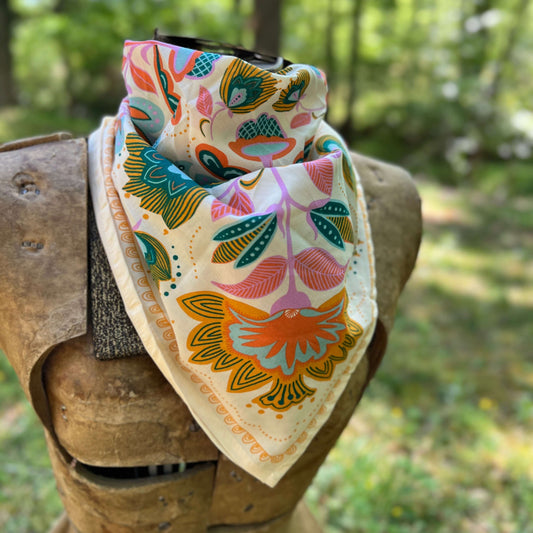 Colorful floral-patterned bandana  with a blurred natural background