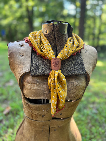 golden yellow floral bandana with lace trim and leather poppy flower slide