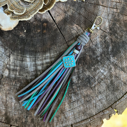 gray, purple, green, blue and brown tassel bag charm with rustic charm and wood beads on antique brass clip