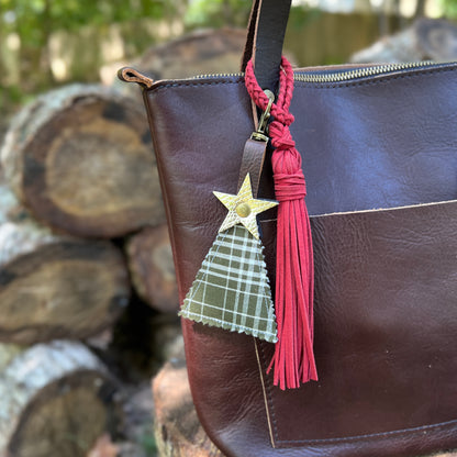 green plaid christmas tree charm with red tassel on brown tote