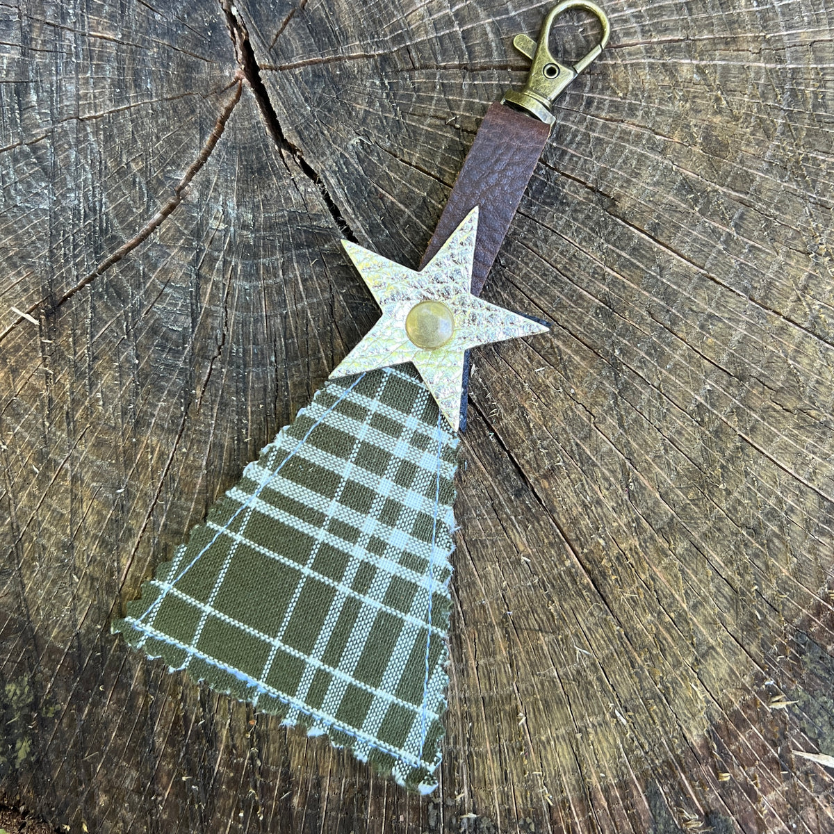 green plaid tree with gold leather star on clip