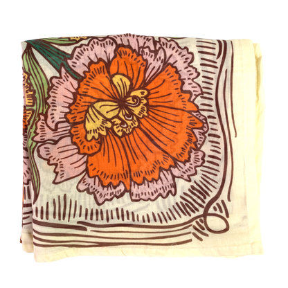 A square scarf featuring a vintage-style floral print with a prominent orange flower, pink and yellow petals, and brown linework on a cream background.