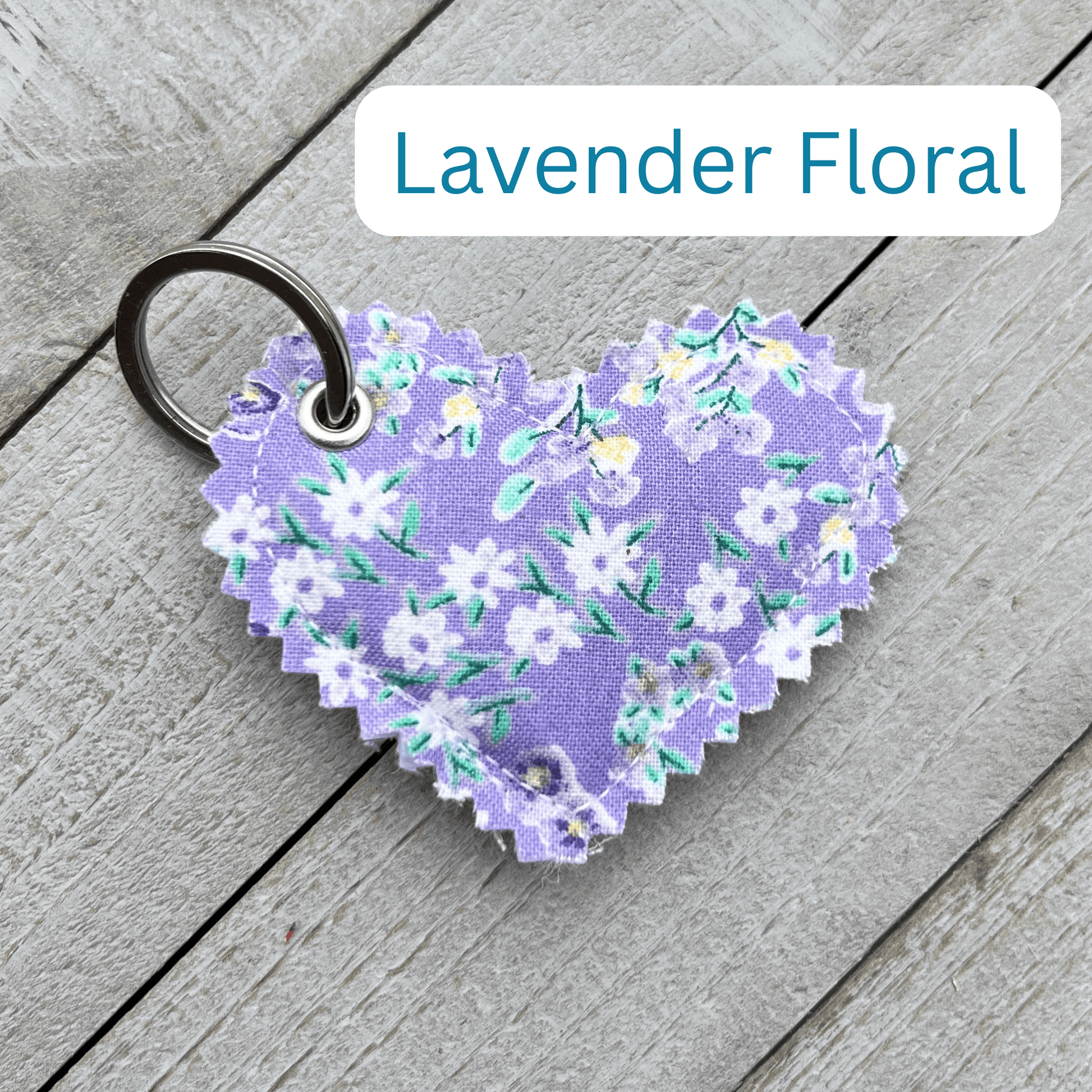 Heart-shaped lavender floral keychain on a wooden surface with 'Lavender Floral' text above.