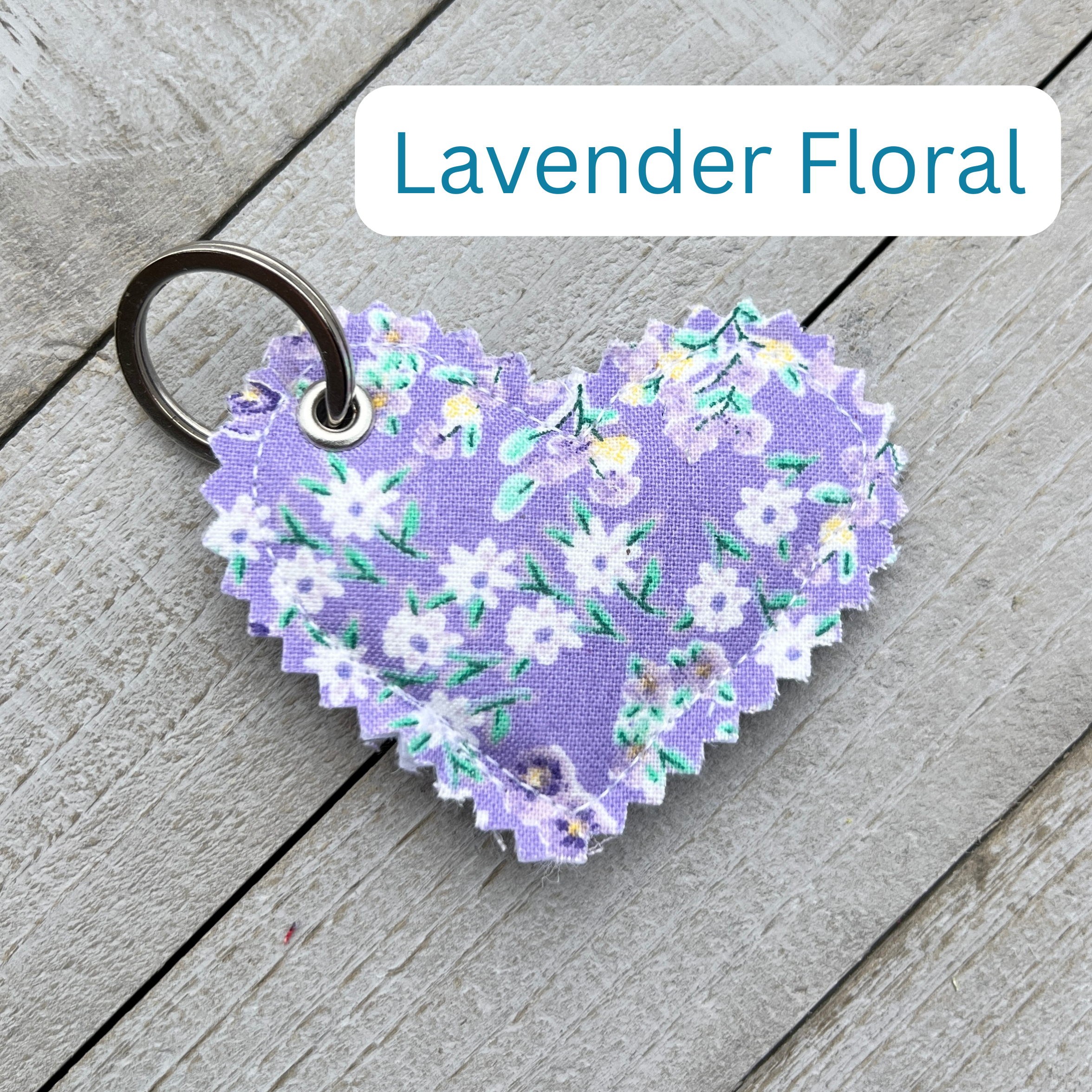 Heart-shaped lavender floral keychain on a wooden surface with 'Lavender Floral' text above.