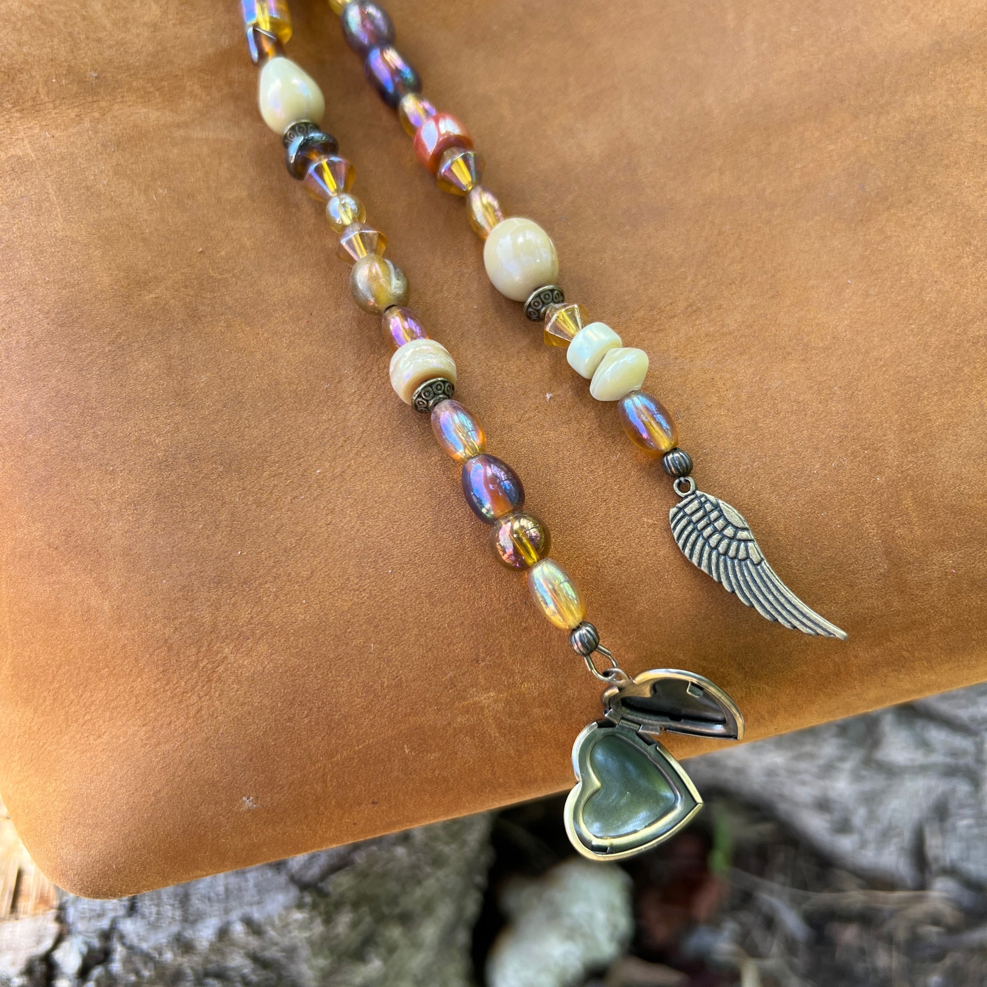 glass bead bag charm with locket and angel wings