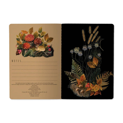 Notebook with nature-themed design on beige and black pages