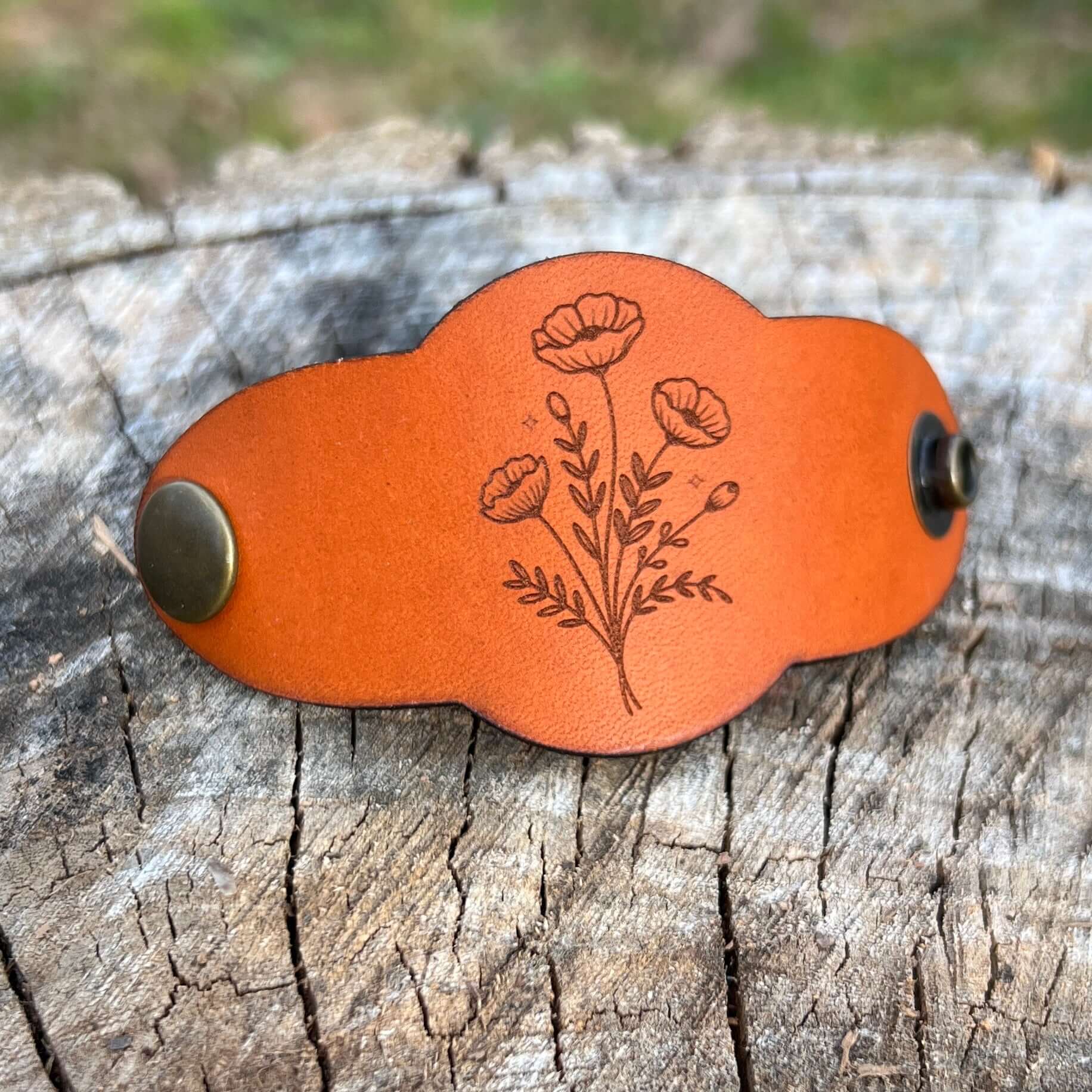 leather bandana slide with poppy flowers in saddle tan