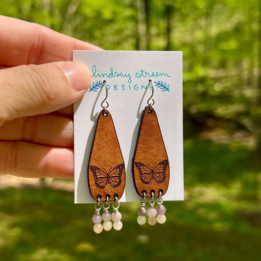 leather dangle earrings with butterfly and pink and purple stones
