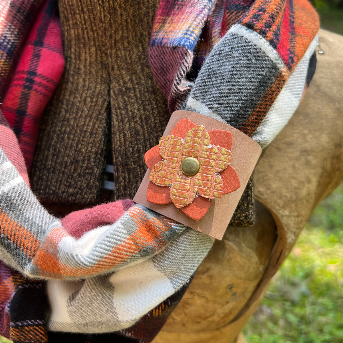 leather scarf cuff with orange flower on plaid flannel scarf
