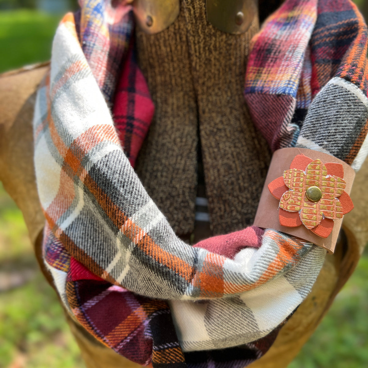 leather scarf cuff with orange flower on plaid flannel scarf