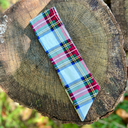 plaid holiday purse scarf on tree stump