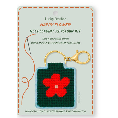 needlepoint keychain kit with happy flower on white background