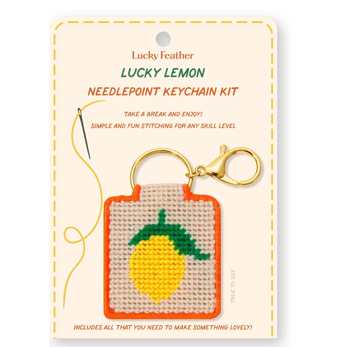 needlepoint keychain kit with yellow lemon on white background