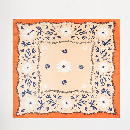 orange floral square scarf on white background