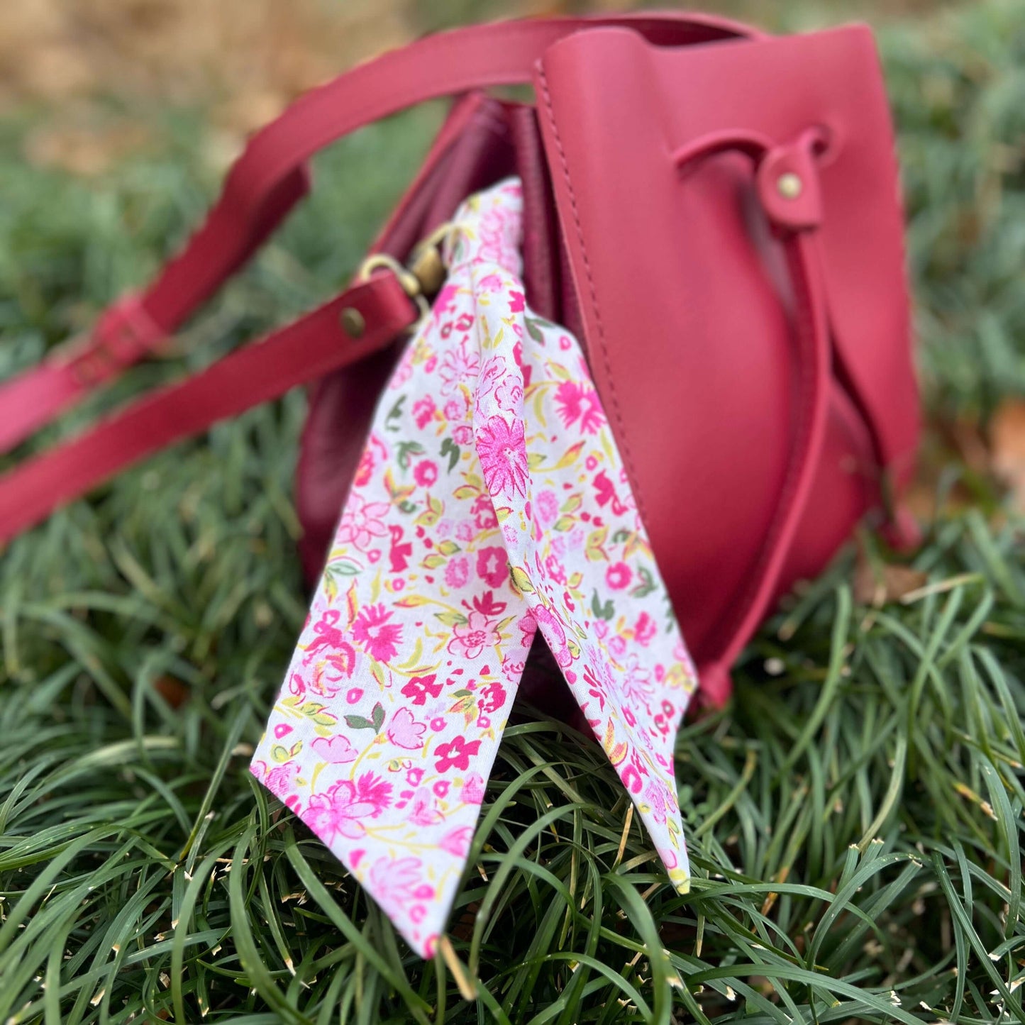 pink floral purse scarf on pink bucket bag