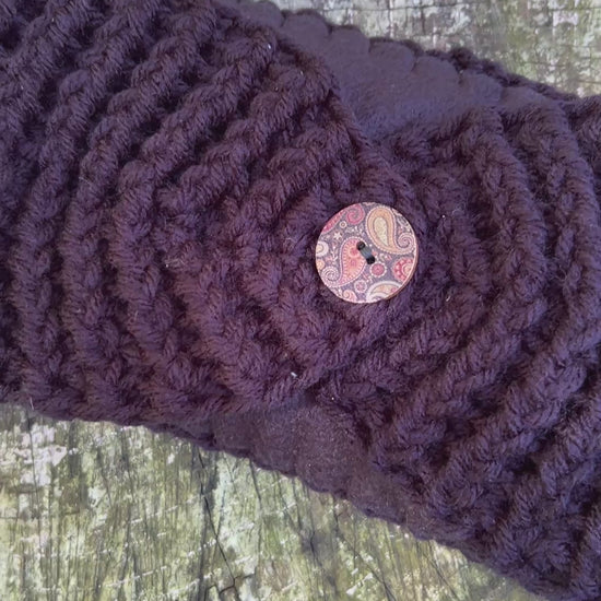 black winter headband with fleece lining and button