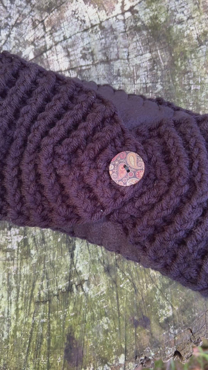 black winter headband with fleece lining and button