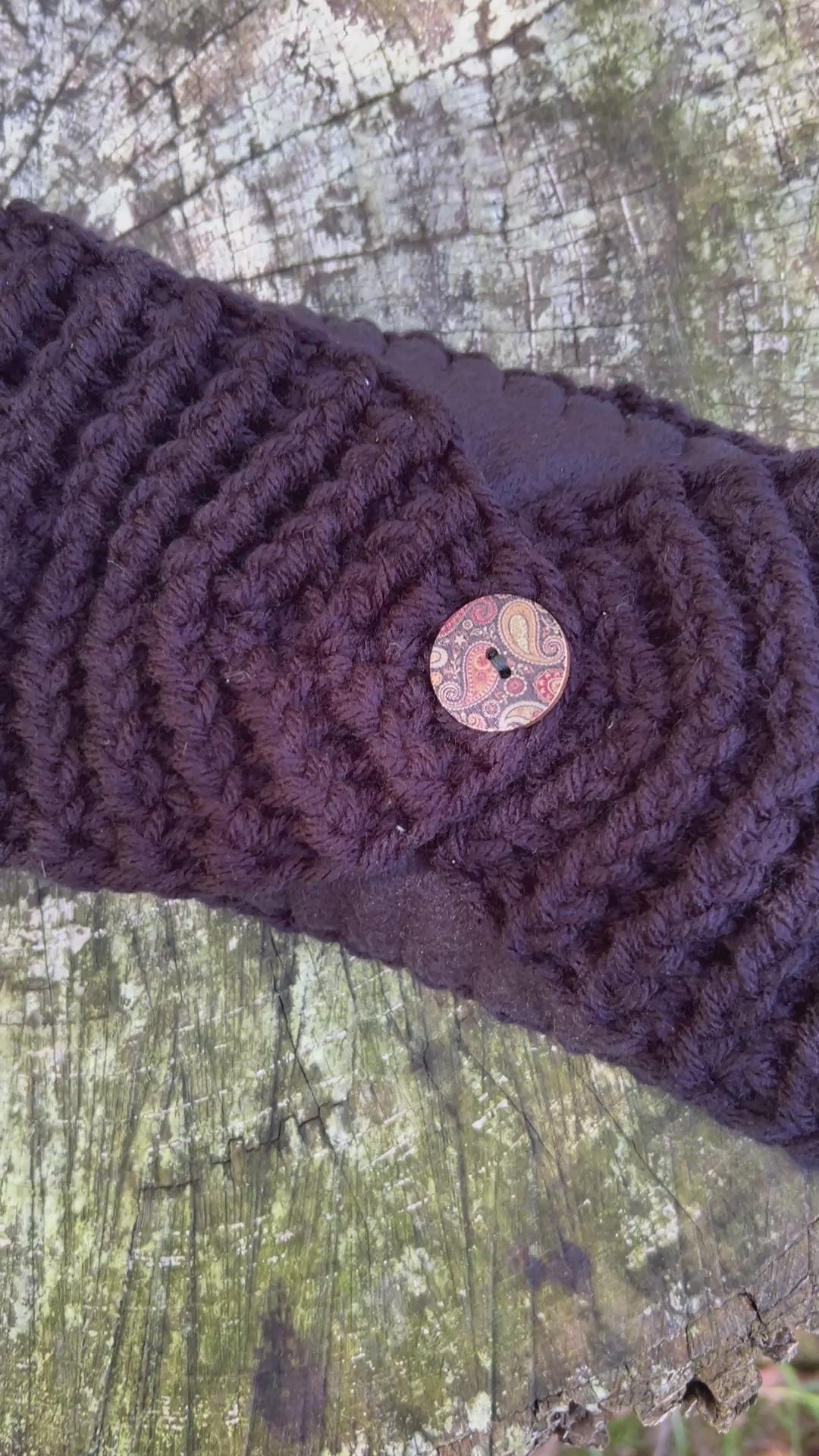 black winter headband with fleece lining and button
