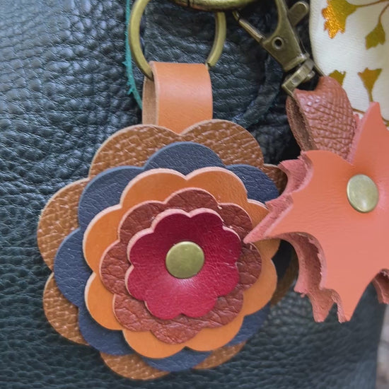 bag charms on blue tote