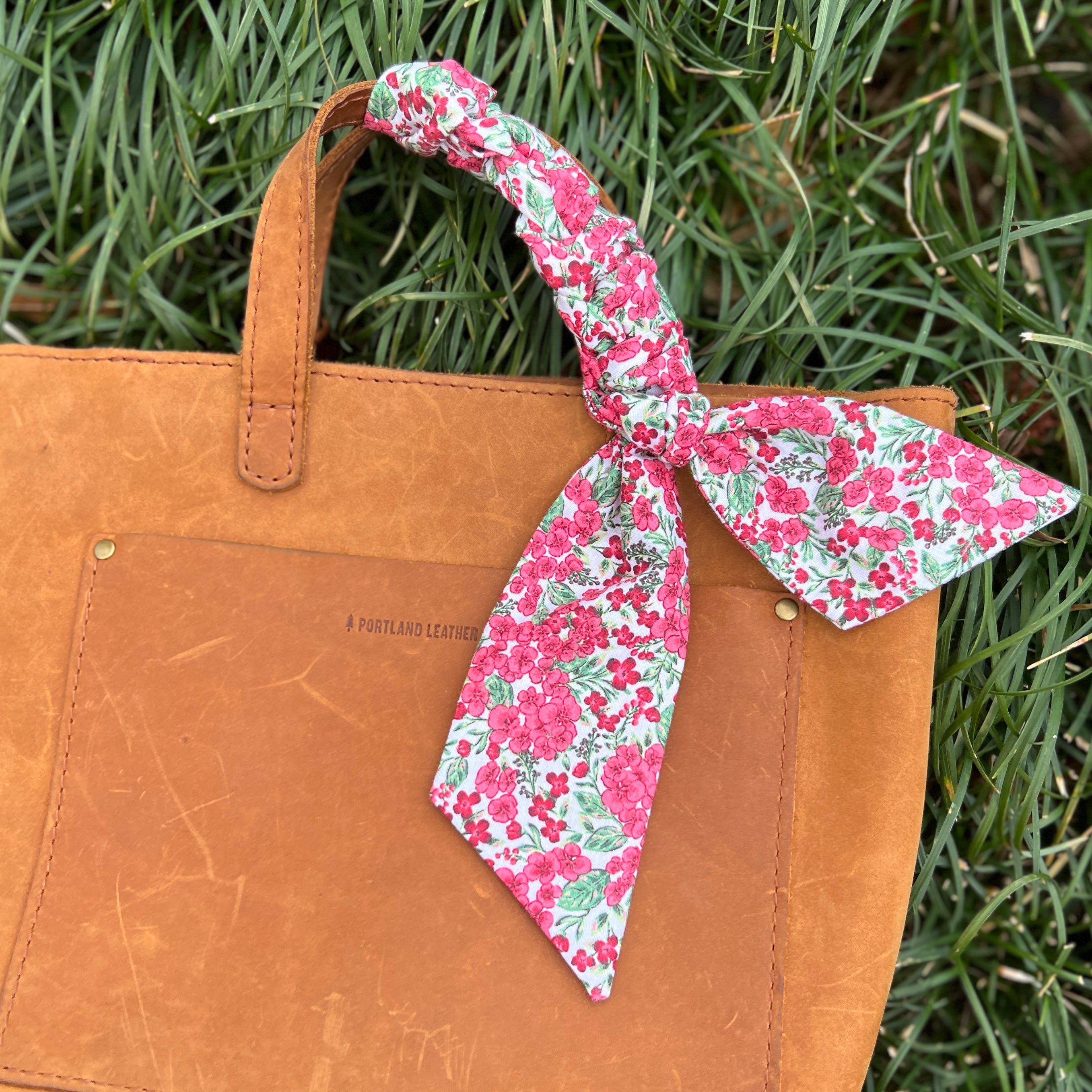 purse scarf in red and pink floral on brown handbag