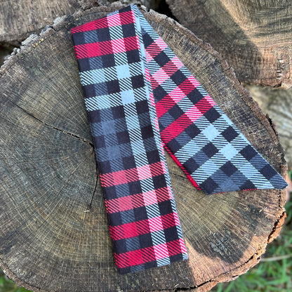 red and black plaid flannel purse scarf on wooden surface