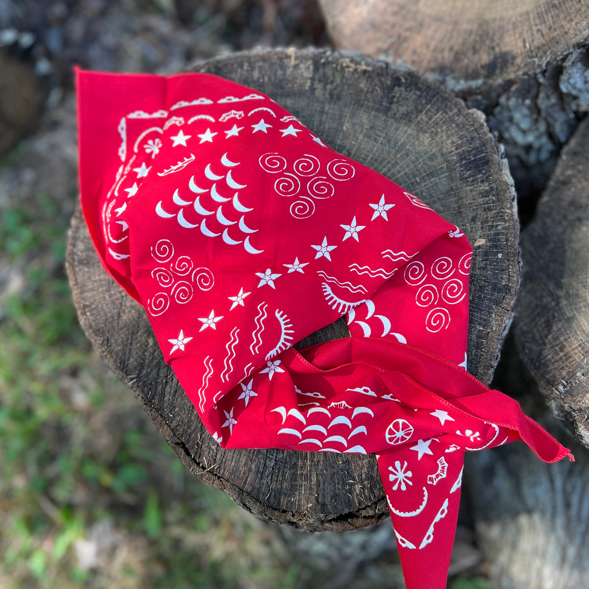 red and white bandana on wooden surface