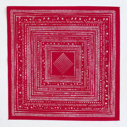 Red bandana with white geometric pattern on a white background
