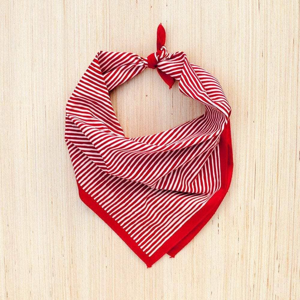 Red and white striped bandana on a wooden surface