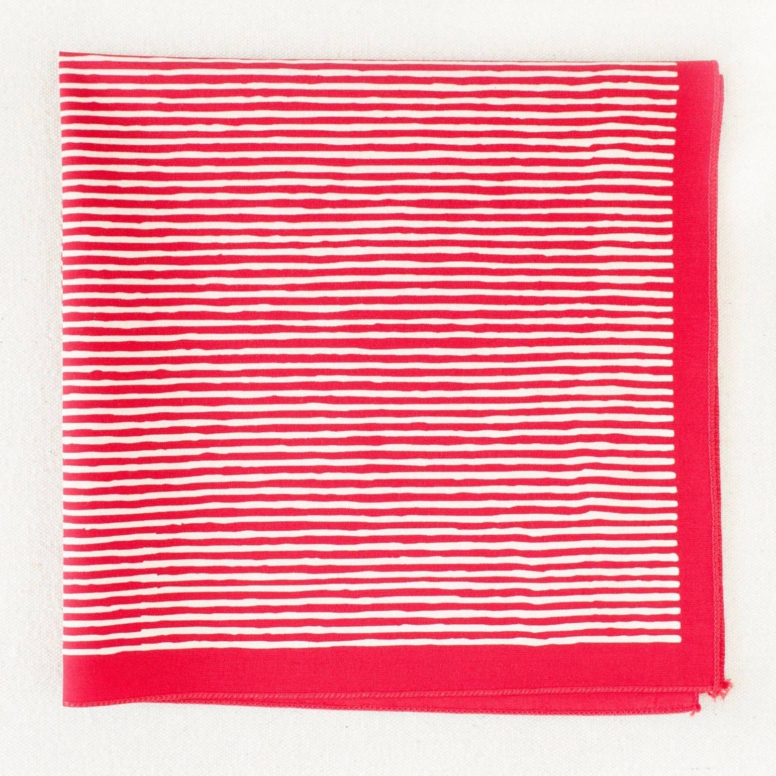 Red and white striped bandana on a white background